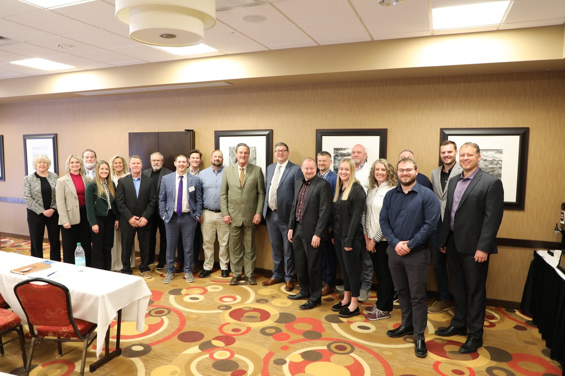 Michelle Bostinelos standing with members of the Dakota Valley Business Council inside the South Dakota State Capitol during Pierre Legislative Days, gathered to discuss regional economic and community priorities 