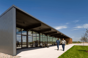 The SIMPCO building exterior with people