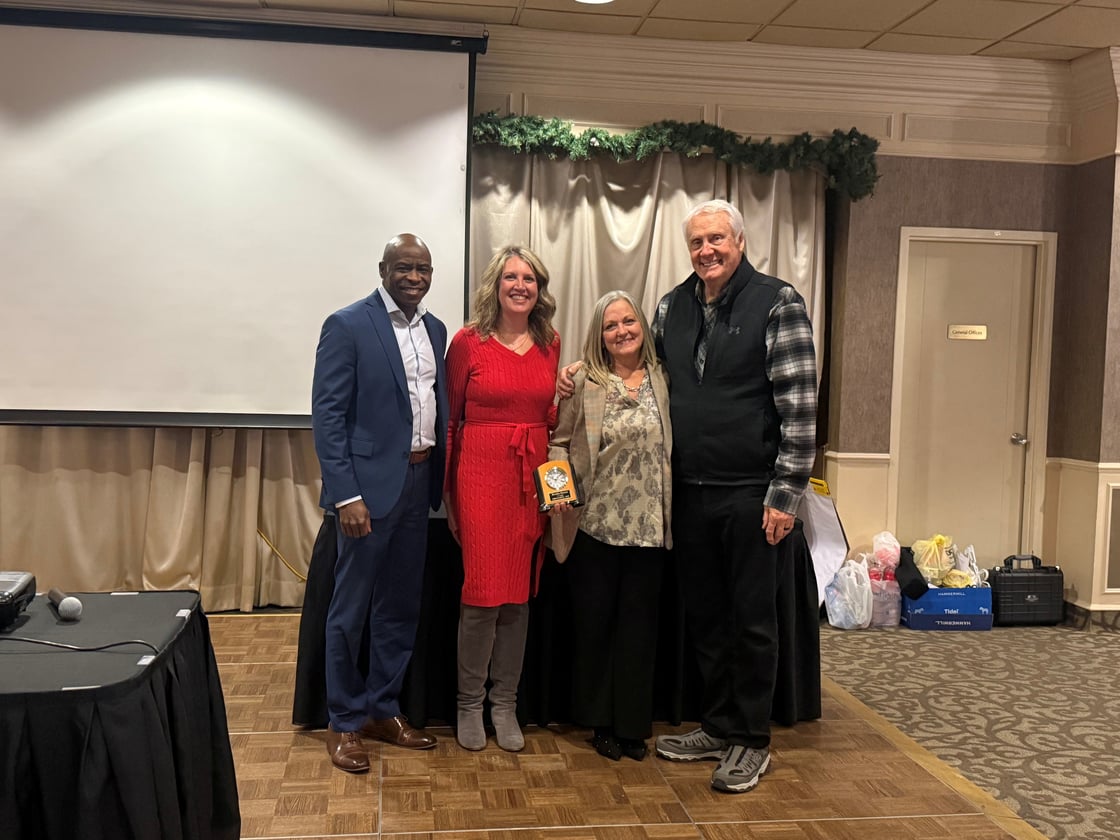 Brenda Berens Accepting Award with Brian Pearson, Michelle Bostinelos, and Jon Winkel