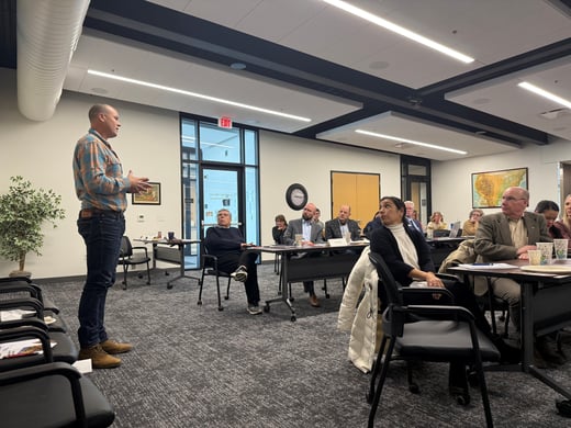 Iowa Representative JD Scholten standing addressing room