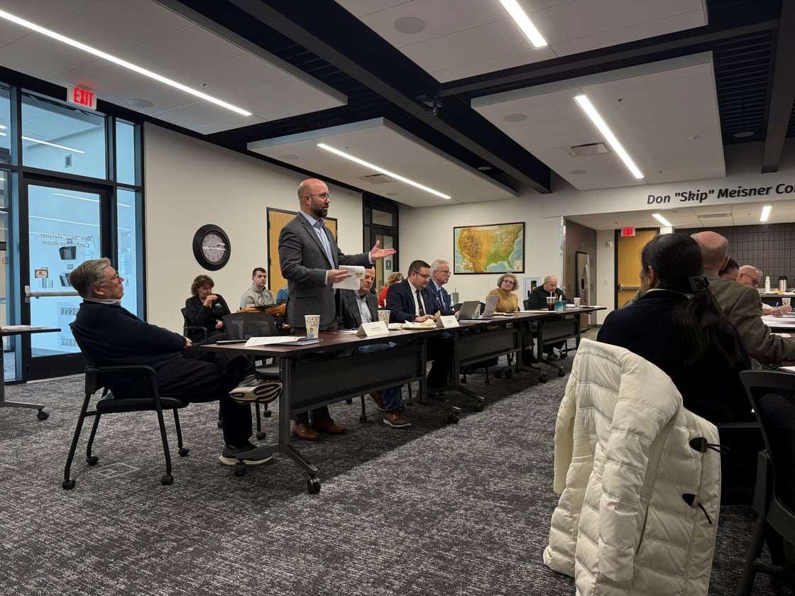 Iowa Representative Jacob Bossman standing addressing room