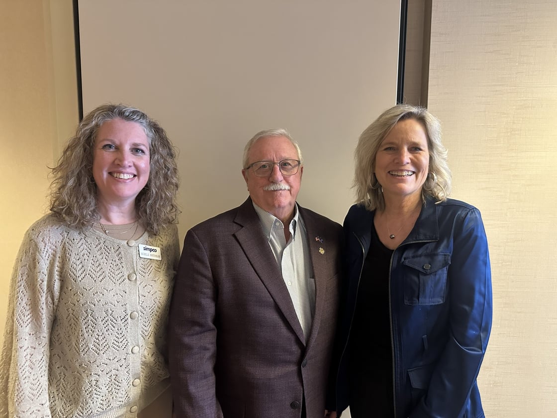Michelle Bostinelos with Iowa State Senator Jim Carlin and Barbara Sloniker at the Iowa State Capitol during regional advocacy meetings.