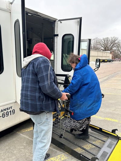 Passenger loading bus using wheel chair lift