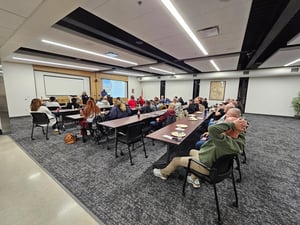 Photo of SRTS employees in SIMPCO Training room sitting in meeting