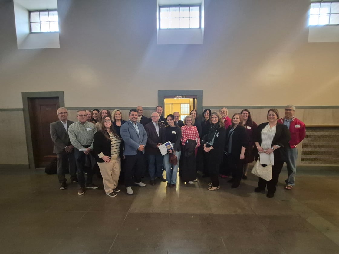 Michelle Bostinelos with members of the South Sioux City Area Chamber of Commerce & Tourism at the Nebraska State Capitol after meeting with Nebraska legislators to discuss cross‑state collaboration