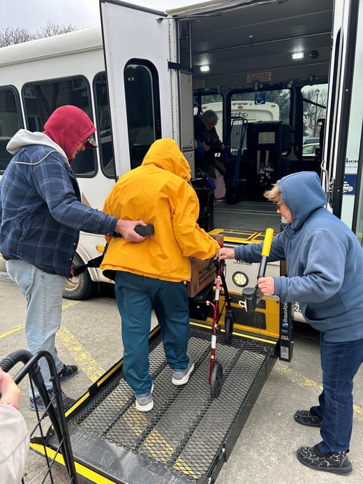 photo of rider getting on SRTS bus using wheel chair lift