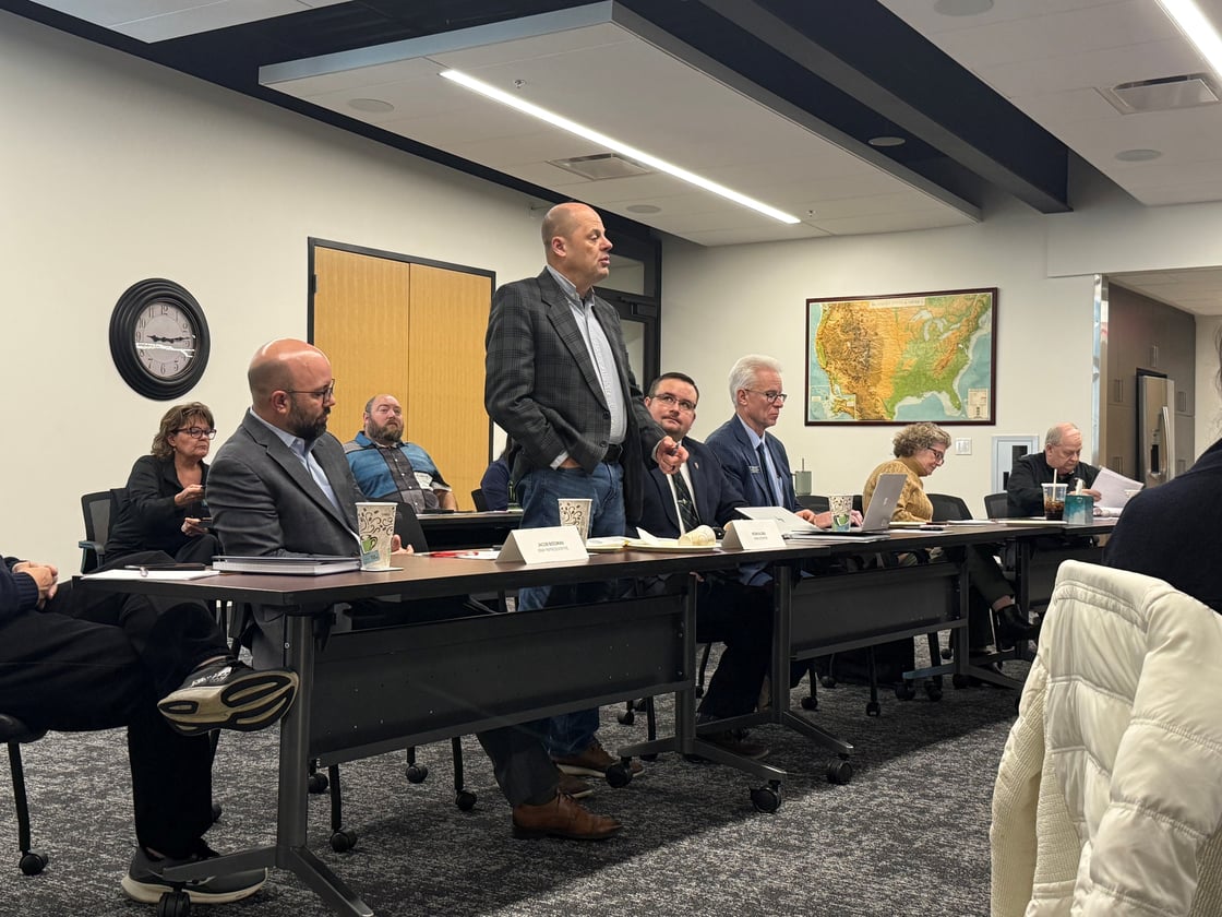 Senator Kevin Alons standing addressing room